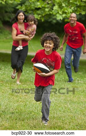 Family running in park View Large Photo Image Stock Image - Family running in park. Fotosearch
