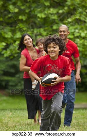 Family running in park View Large Photo Image Stock Image - Family running in park. Fotosearch
