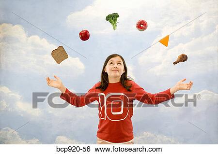 Girl juggling different foods View Large Photo Image Stock Photograph - Girl juggling different foods. Fotosearch