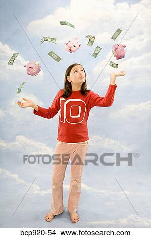 Girl juggling money View Large Photo Image Picture - Girl juggling money. Fotosearch