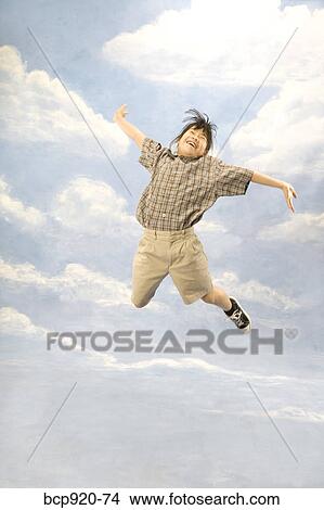 Picture - Girl jumping in air. Fotosearch