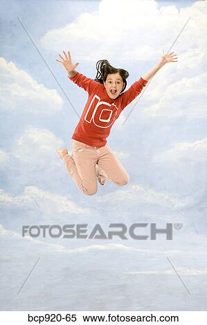 Girl jumping in air View Large Photo Image Stock Photography - Girl jumping in air. Fotosearch