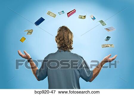Man juggling financial items View Large Photo Image Stock Photo - Man juggling financial items. Fotosearch
