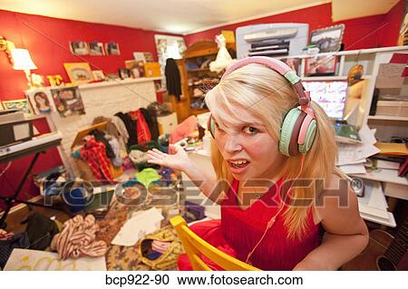 Teen girl in messy room View Large Photo Image Stock Image - Teen girl in messy room. Fotosearch