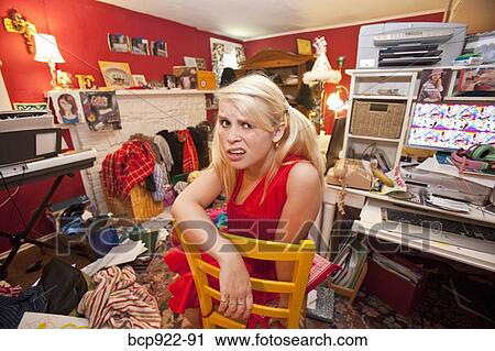 Teen girl in messy room View Large Photo Image Stock Image - Teen girl in messy room. Fotosearch