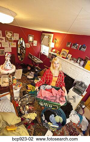 Teen girl in messy room View Large Photo Image Stock Image - Teen girl in messy room. Fotosearch