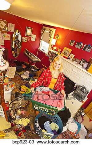 Teen girl in messy room View Large Photo Image Stock Image - Teen girl in messy room. Fotosearch