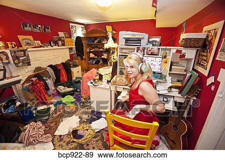 Teen girl in messy room View Large Photo Image Stock Photo - Teen girl in messy room. Fotosearch