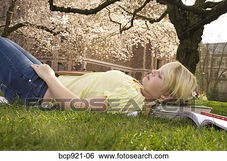 Teen girl on college campus View Large Photo Image Stock Photograph - Teen girl on college campus. Fotosearch