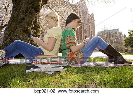 Teen girls on college campus View Large Photo Image Stock Image - Teen girls on college campus. Fotosearch
