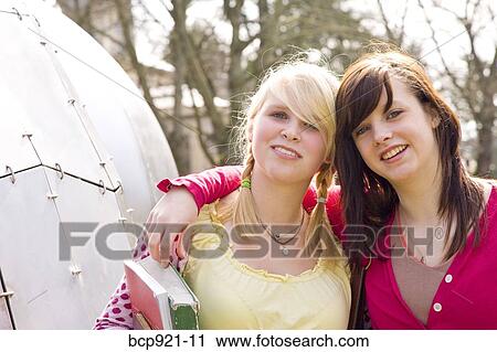 Teen girls on college campus View Large Photo Image Stock Image - Teen girls on college campus. Fotosearch