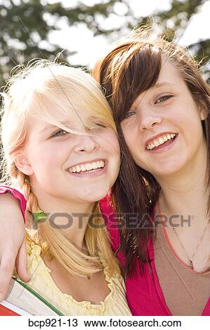 Teen girls on college campus View Large Photo Image Stock Image - Teen girls on college campus. Fotosearch
