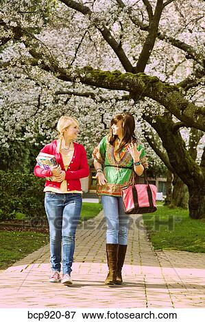 Teen girls on college campus View Large Photo Image Stock Photo - Teen girls on college campus. Fotosearch