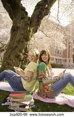 Teen girls on college campus View Large Photo Image Stock Photo - Teen girls on college campus. Fotosearch