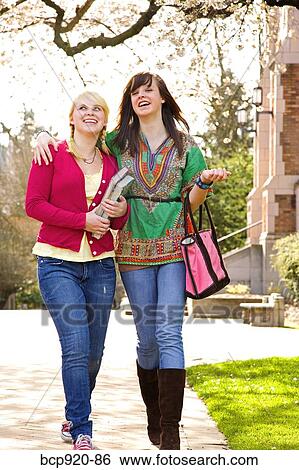 Teen girls on college campus View Large Photo Image Stock Photograph - Teen girls on college campus. Fotosearch