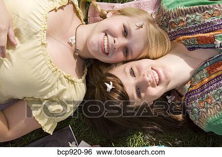 Teen girls on college campus View Large Photo Image Stock Photograph - Teen girls on college campus. Fotosearch