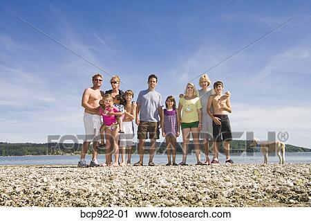 Three generations of family on beach View Large Photo Image Stock Image - Three generations of family on beach. Fotosearch