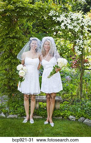 Two brides in garden View Large Photo Image Stock Image - Two brides in garden. Fotosearch