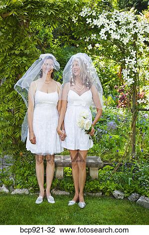 Two brides in garden View Large Photo Image Stock Image - Two brides in garden. Fotosearch