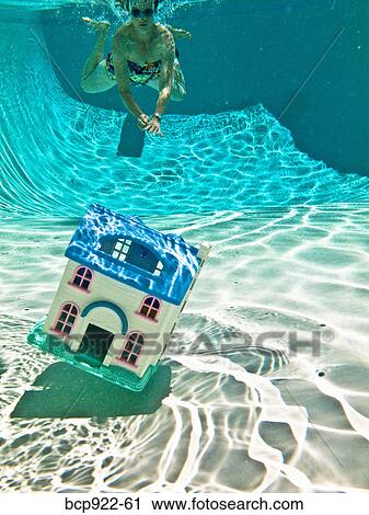 Woman underwater with house View Large Photo Image Stock Image - Woman underwater with house. Fotosearch