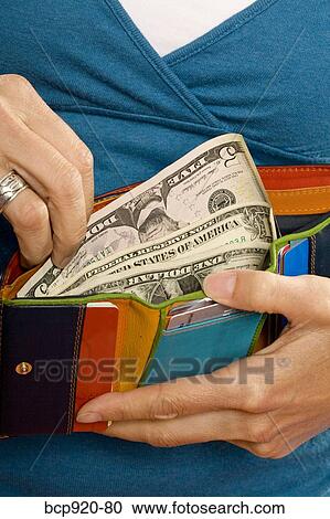 Stock Image - Woman with money. Fotosearch