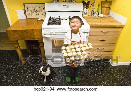 Young boy making cupcakes View Large Photo Image Picture - Young boy making cupcakes. Fotosearch