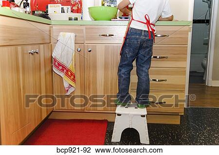 Young boy making cupcakes View Large Photo Image Stock Image - Young boy making cupcakes. Fotosearch
