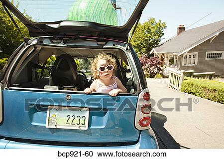 Young girl in back of smart car View Large Photo Image Stock Image - Young girl in back of smart car. Fotosearch