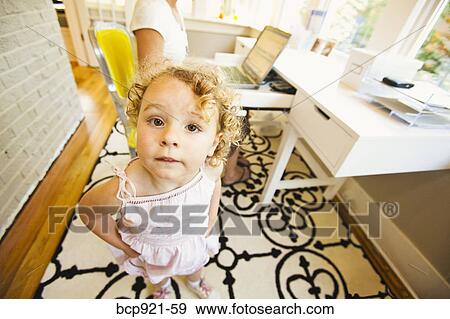 Young girl with woman in home office View Large Photo Image Stock Photo - Young girl with woman in home office. Fotosearch