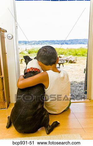 Boy and dog sitting in camper doorway View Large Photo Image Stock Image - Boy and dog sitting in camper doorway. Fotosearch