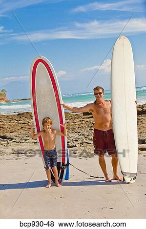 father and son with surfboards in mexico View Large Photo Image Stock Photo - father and son with surfboards in mexico. Fotosearch