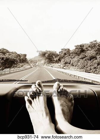 feet on car dashboard View Large Photo Image Picture - feet on car dashboard. Fotosearch