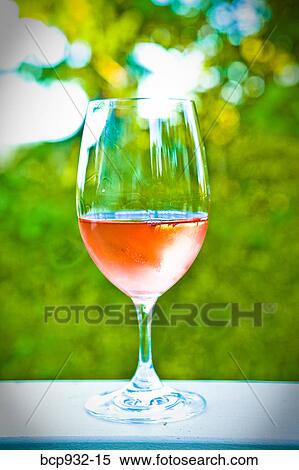 glass of white wine on outdoor table View Large Photo Image Stock Photography - glass of white wine on outdoor table. Fotosearch