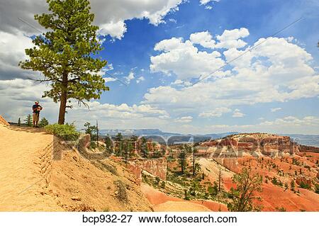 man standing on bluff in bryce canyon, utah View Large Photo Image Stock Photo - man standing on bluff in bryce canyon, utah. Fotosearch
