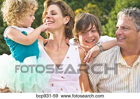 portrait of family of four View Large Photo Image Stock Photo - portrait of family of four. Fotosearch