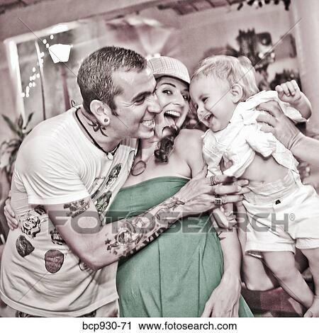 tattoed mom and dad with baby View Large Photo Image Stock Image - tattoed mom and dad with baby. Fotosearch