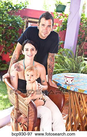 tattoed mom and dad with baby View Large Photo Image Stock Photo - tattoed mom and dad with baby. Fotosearch