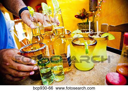 Stock Photograph - waiter serving drinks in mexico. Fotosearch