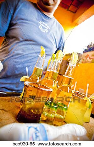 Stock Photography - waiter serving drinks in mexico. Fotosearch