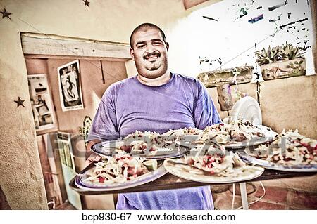 waiter with platters of food in mexico View Large Photo Image Stock Photo - waiter with platters of food in mexico. Fotosearch