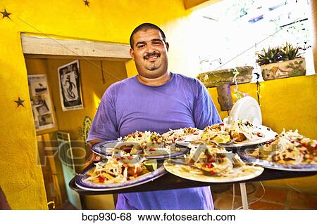 waiter with platters of food in mexico View Large Photo Image Stock Photo - waiter with platters of food in mexico. Fotosearch