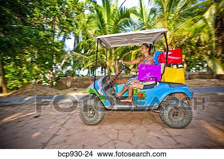 Woman shopping with golf cart in mexico View Large Photo Image Picture - Woman shopping with golf cart in mexico. Fotosearch