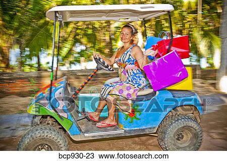 Woman shopping with golf cart in mexico View Large Photo Image Stock Image - Woman shopping with golf cart in mexico. Fotosearch