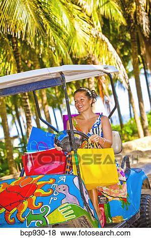 Woman shopping with golf cart in mexico View Large Photo Image Stock Photo - Woman shopping with golf cart in mexico. Fotosearch