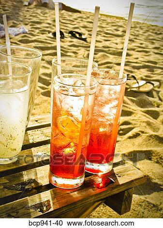cocktails on beachside table View Large Photo Image Stock Image - cocktails on beachside table. Fotosearch