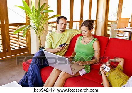 family on sofa with laptop View Large Photo Image Stock Photo - family on sofa with laptop. Fotosearch