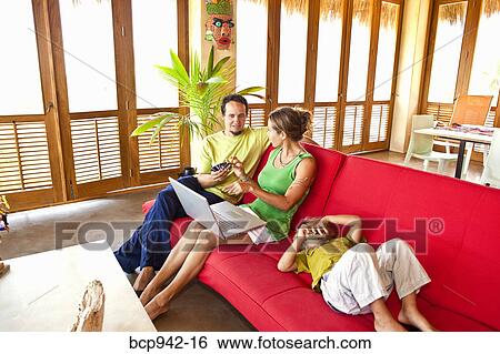 family on sofa with laptop View Large Photo Image Stock Photograph - family on sofa with laptop. Fotosearch