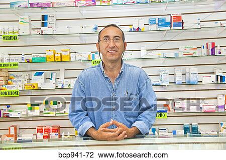 latino pharmacist at counter View Large Photo Image Stock Image - latino pharmacist at counter. Fotosearch