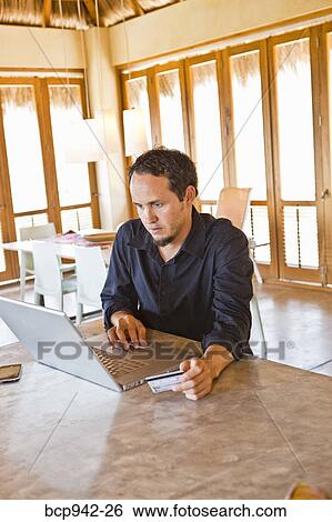 man working on laptop at home View Large Photo Image Stock Photograph - man working on laptop at home. Fotosearch