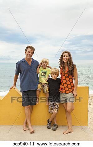 portrait of parents with young sons View Large Photo Image Stock Image - portrait of parents with young sons. Fotosearch